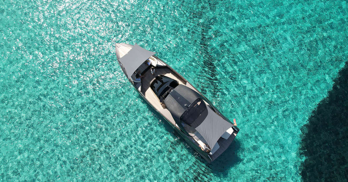 A rental boat in the crystal-clear waters of Ibiza