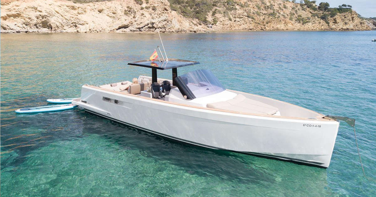 A rental boat anchored in Ibiza's crystal clear waters